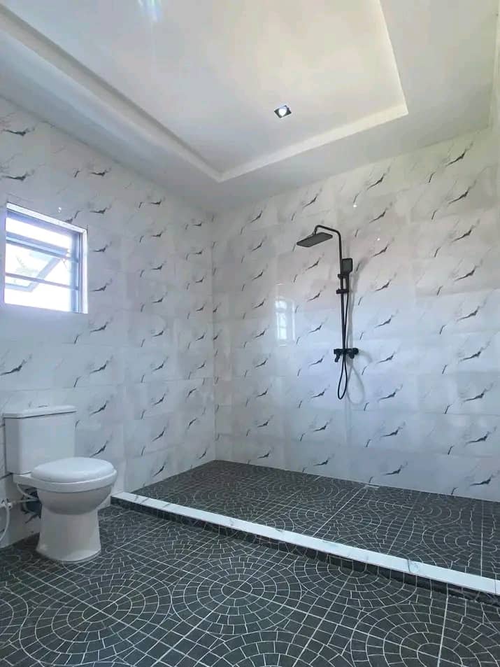 Luxury tiled bathroom by AyElite